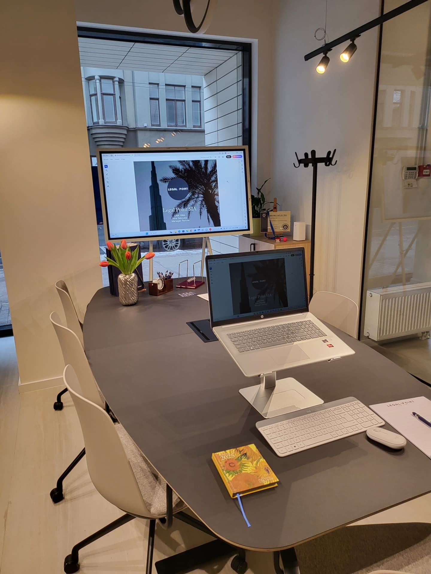 Legal Point consultation room in Riga with Legal Point branding on screen